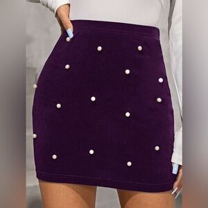 Purple velvet skirt with pearl embellishments